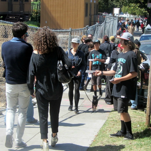Paul Jr. passes out tracts at Dolores Park